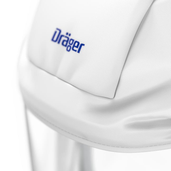 Schutzmaske von Dräger Sicherheitstechnik Nahaufnahme der Dräger-Schutzmaske mit weißer Oberfläche und blauem Logo.
