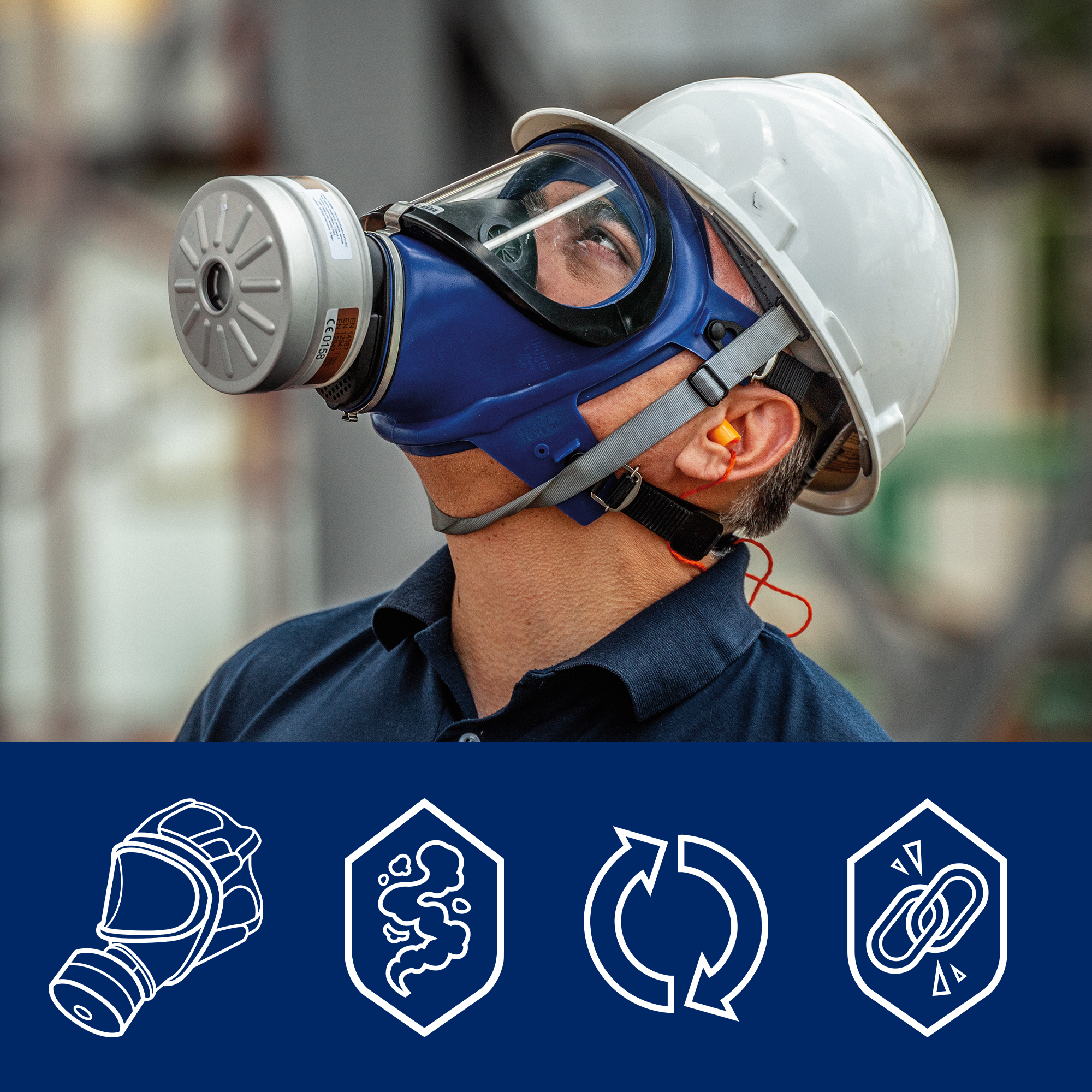 Arbeiter mit Schutzmaske und Helm, trägt Dräger Filter.
