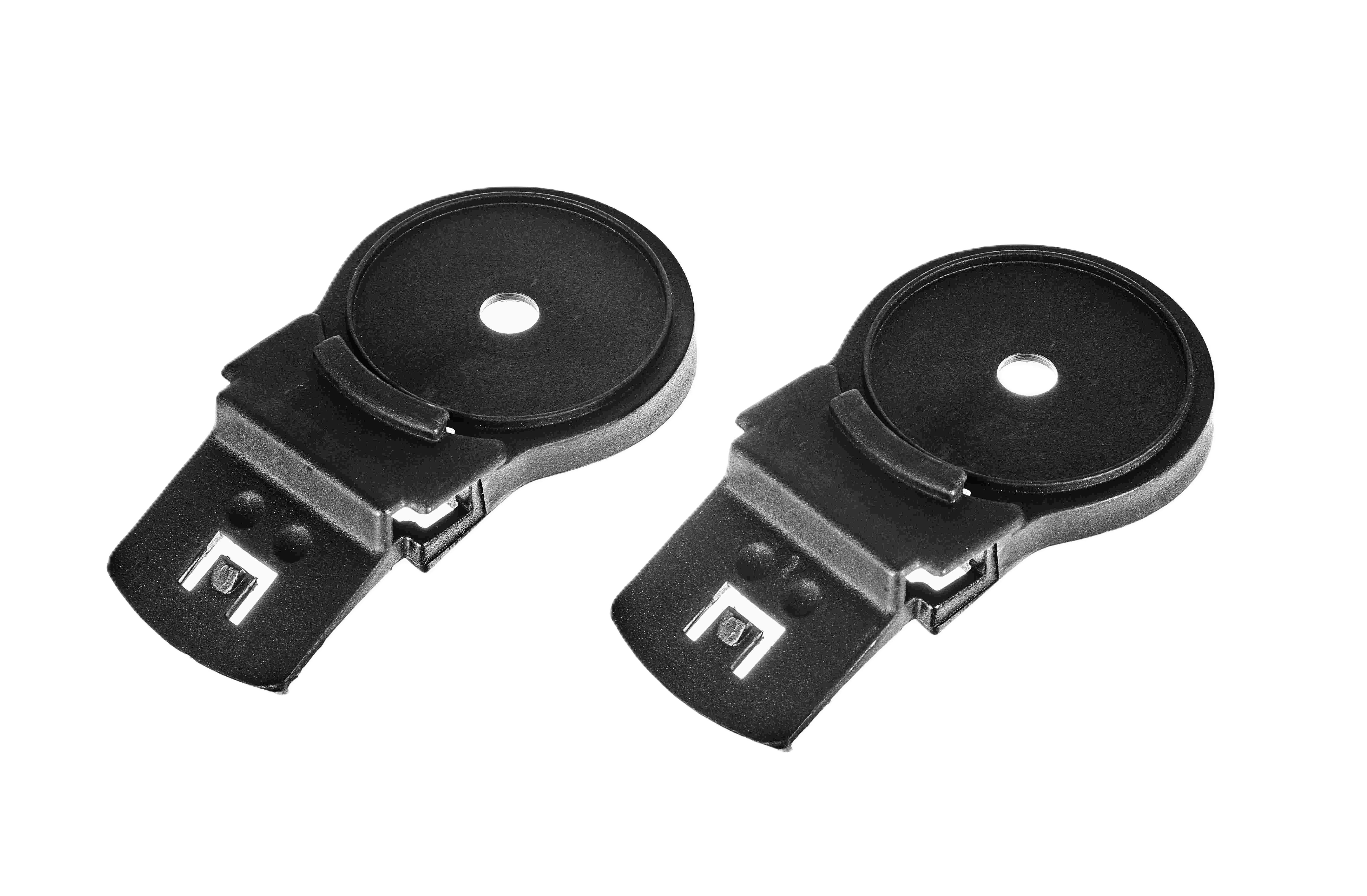 Zwei schwarze Clips mit rundem Design und Metallverschluss.