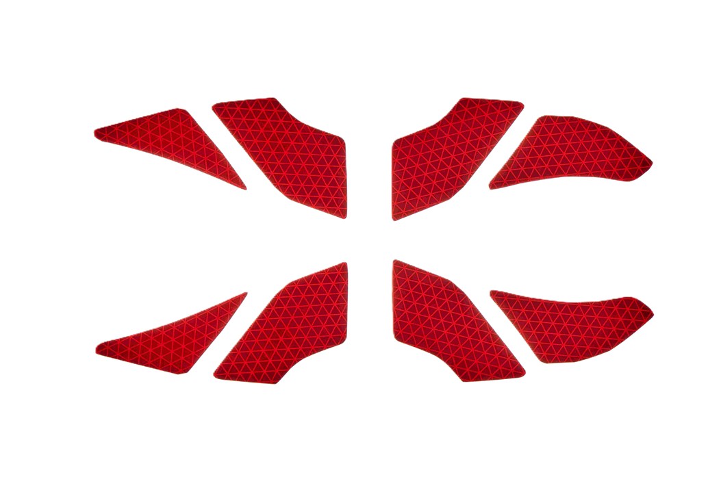 Rote Reflektoren in geometrischen Formen auf weißem Hintergrund.
