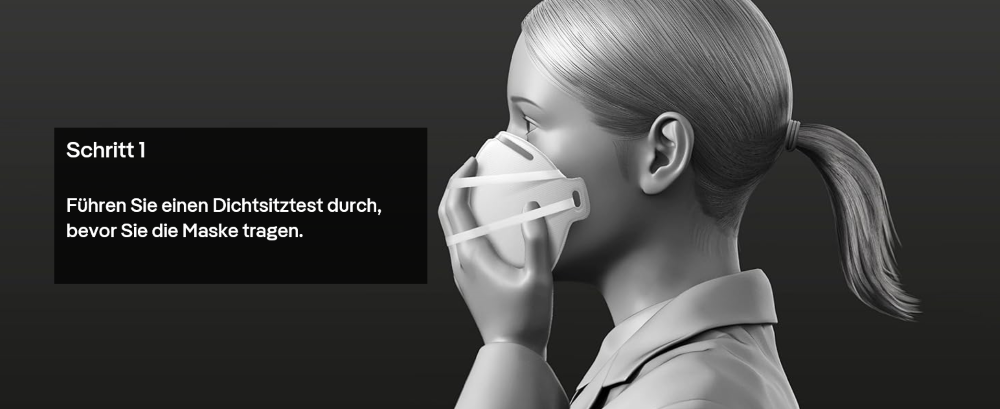 Person zeigt den ersten Schritt der Staubmasken-Benutzung.