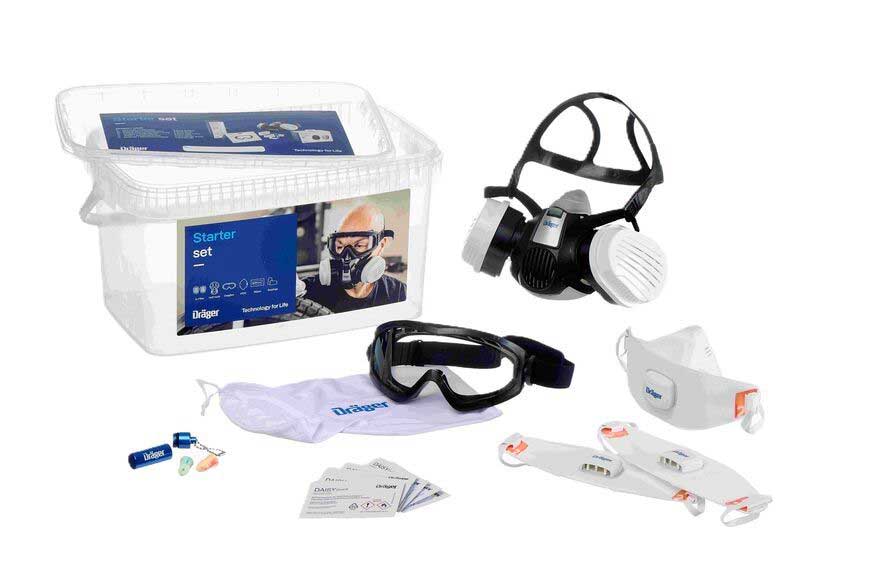 Dräger Sicherheitstechnik Starterset Starterset zeigt Atemschutzmaske, Schutzbrille und Zubehör in einer Box.
